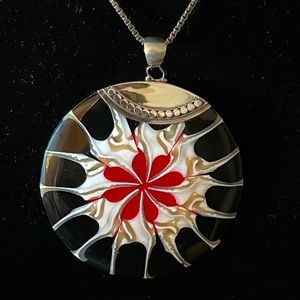 Statement piece is one way to describe this artistic shell and sterling pendant